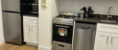 Coffee/tea maker, fridge, microwave, oven