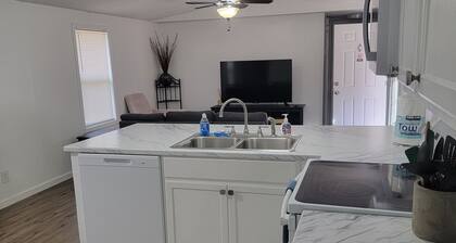 Surrounded by sweetgum and maple trees, this house is perfect for some R & R.