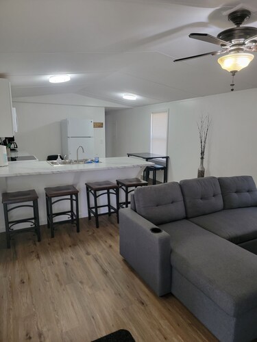 Surrounded by sweetgum and maple trees, this house is perfect for some R & R.