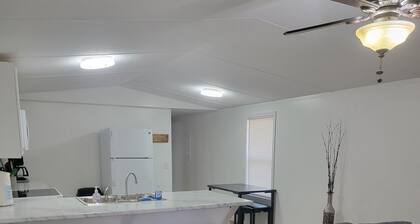 Surrounded by sweetgum and maple trees, this house is perfect for some R & R.