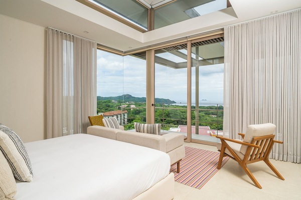 Master bedroom steps out to a private balcony over the pool.