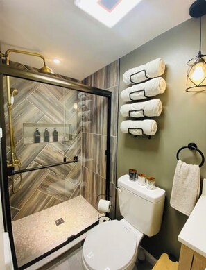 Shower, hair dryer, towels, soap