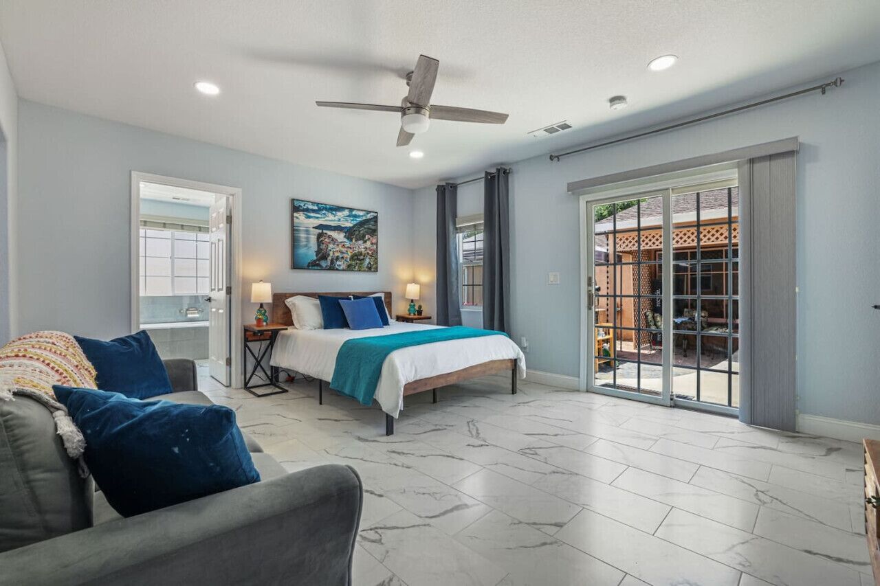 **Cozy and Inviting Bedroom**  Relax in our cozy and inviting bedroom, featuring a comfortable queen bed, stylish decor, and ample natural light. Perfect for unwinding after a day of exploring. Book now for a restful and rejuvenating stay!