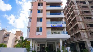 A multi-story hotel with a prominent 'fab hotels' sign on the ground floor. - Fabhotel Prime Athiti Delight Stay (Pune)
