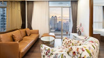 Basic Apartment, 3 Bedrooms, Balcony, City View | Living area | 40-inch flat-screen TV with satellite channels, smart speakers