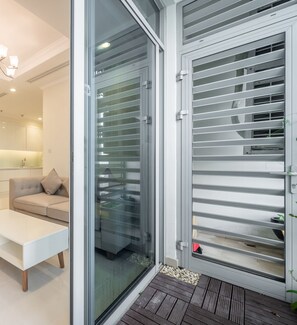 Basic Apartment, 2 Bedrooms, 2 Bathrooms, City View | Living area | 40-inch flat-screen TV with satellite channels, smart speakers - Landmark 81 Luxury - SaigonHomes (Ho Chi Minh City)
