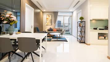 Basic Apartment, 3 Bedrooms, Balcony, City View | Living area | 40-inch flat-screen TV with satellite channels, smart speakers