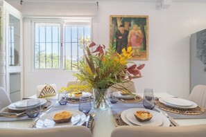 Enjoy meals in this beautifully set dining area with a stunning view.