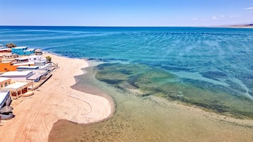 Beach nearby, sun-loungers, beach towels