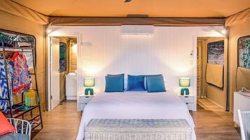 Deluxe Suite (Tent 3) | Premium bedding, pillow-top beds, laptop workspace, rollaway beds
