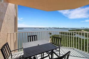 Outdoor dining - Stunning 12th Floor Views! Pool & Hot Tub! No Resort Fees & Over $150 of Free Daily Activities! (Fort Myers Beach)