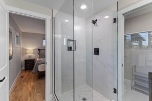 Shower, hair dryer, towels, shampoo