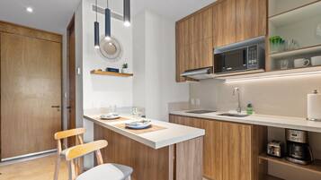 Fridge, microwave, stovetop, coffee/tea maker
