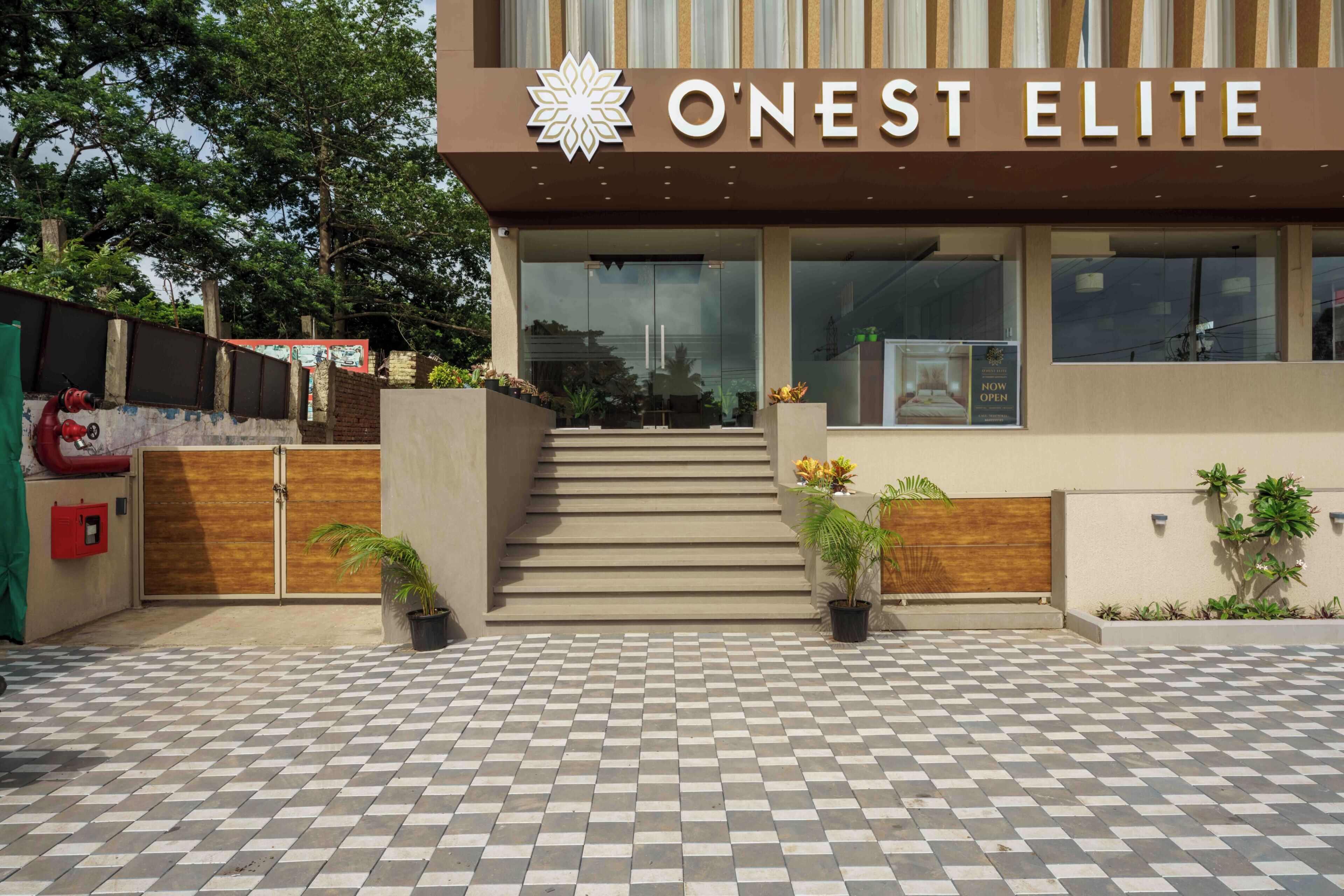 A modern building with a sign reading 'O'Nest Elite.'
