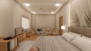 Ein modernes Schlafzimmer mit Bett, Schreibtisch, Sofa und Fernseher.