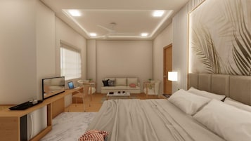 Un dormitorio moderno con cama, escritorio, sofá y televisor.