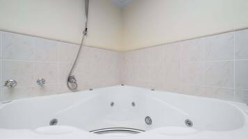 Shower, hair dryer, towels, shampoo
