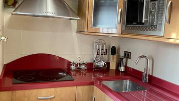 Fridge, microwave, coffee/tea maker, toaster