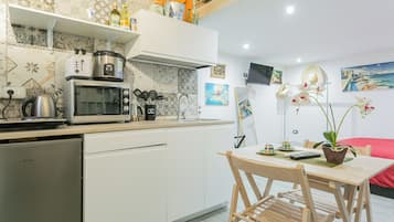 Apartment | Private kitchen | Electric kettle, dining tables