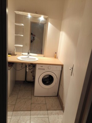 Shower, towels, soap, toilet paper