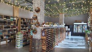 A bookstore with shelves of books and a coffee machine. - Serenity at Sparrowhawk Lodge Brand New 2Bd 2Ba (Dead Man's Flats)