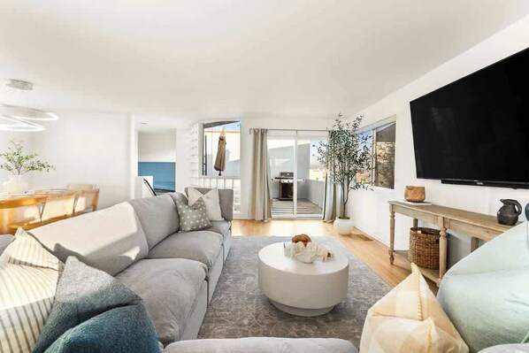 Relax in style in this modern living room with breathtaking ocean views