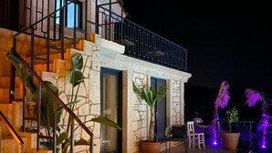 A two-story house with a pool, outdoor seating, and potted plants. - Lotus Port  (Cesme)