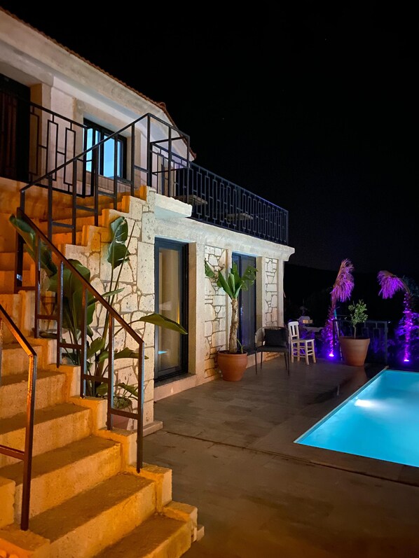 A two-story house with a pool, outdoor seating, and potted plants. - Lotus Port  (Cesme)