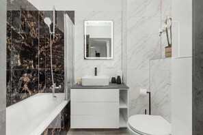 Shower, hair dryer, towels, shampoo