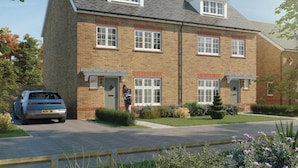 A two-story residential building with a pitched roof, multiple windows, and a car parked in the driveway. - 3 Bedroom 3.5 Bathroom House Chichester (Chichester)