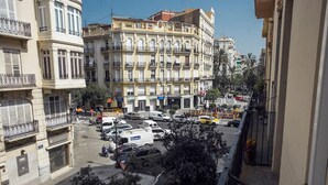 A multi-story building with a classical architectural style, featuring balconies and a central courtyard. - Remarkable 3 Bedroom Apartment in L'eixample (Valencia)
