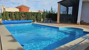 A rectangular swimming pool with clear blue water, surrounded by a concrete deck. - Private Pool- Rooftop Terrace & Bbq- Aircon (Zurgena)