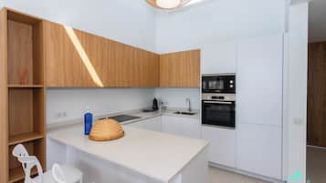 Villa | Private kitchen | Fridge, microwave, oven, stovetop