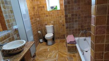Villa | Bathroom | Shower, deep soaking tub, towels
