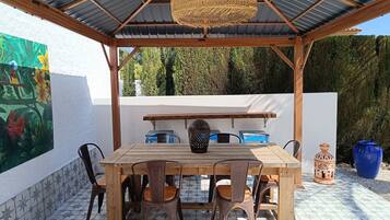 Apartamento | Restaurante al aire libre