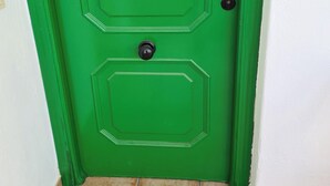 A green door with the number "79" and "cn" indicating size. - Sunset Villa not for Rent (Pulpi)