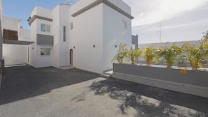 A modern white building with multiple windows and a flat roof. - Beautiful Villa - Near Los Cristianos (Arona)