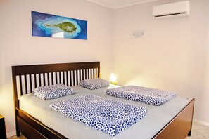 Departamento | 1 habitación, tabla de planchar con plancha, wifi gratis y ropa de cama 