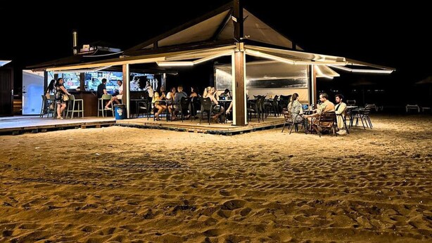 An outdoor dining area with tables and chairs under a covered structure. - Beachfront House,sea Views Near Historic Cartagena (Cartagena)