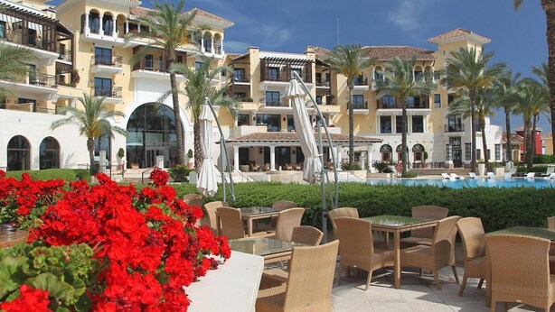 A resort with multiple-story buildings, outdoor seating, and a swimming pool. - Villa Fresno With Pool on Mar Menor Golf Resort (Torre-Pacheco)