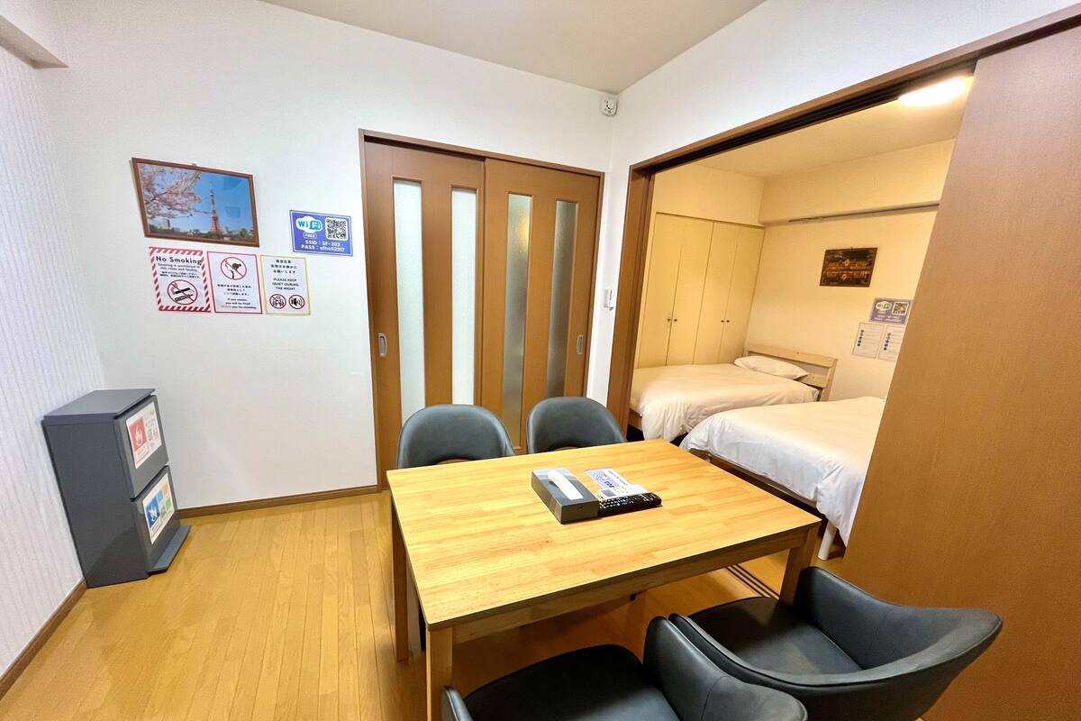 Premium Apartment, 3 Twin Beds | Living area | 32-inch flat-screen TV with digital channels