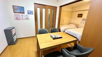 Premium Apartment, 3 Twin Beds | Living area | 32-inch flat-screen TV with digital channels