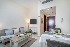 Classic Studio, Balcony, City View | Living area | 50-inch Smart TV with cable channels - Czechin - Royal Breeze 2 (Ras Al Khaimah)