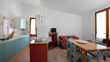 Apartamento | Cozinha privada | Geladeira, fogão, cooktop, cafeteira/chaleira