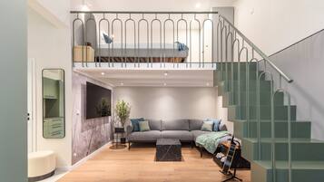 Apartment, Courtyard View | Living area | 65-inch Smart TV with digital channels, Netflix, streaming services