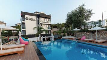 Seasonal outdoor pool, pool umbrellas, pool loungers