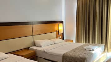 Classic Triple Room, Patio, City View | Desk, laptop workspace, soundproofing, iron/ironing board
