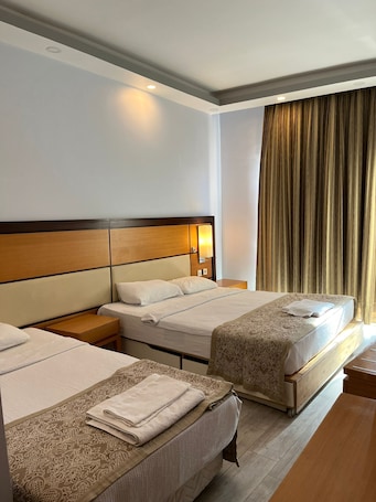 Classic Triple Room, Patio, City View | Desk, laptop workspace, soundproofing, iron/ironing board