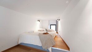 A bedroom with a bed, wooden flooring, white walls, and a window. - Milan Lambrate M2 Center (Milano)