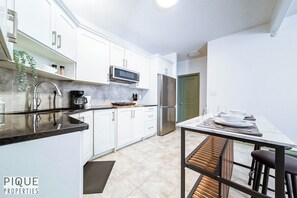 Fridge, microwave, stovetop, coffee/tea maker